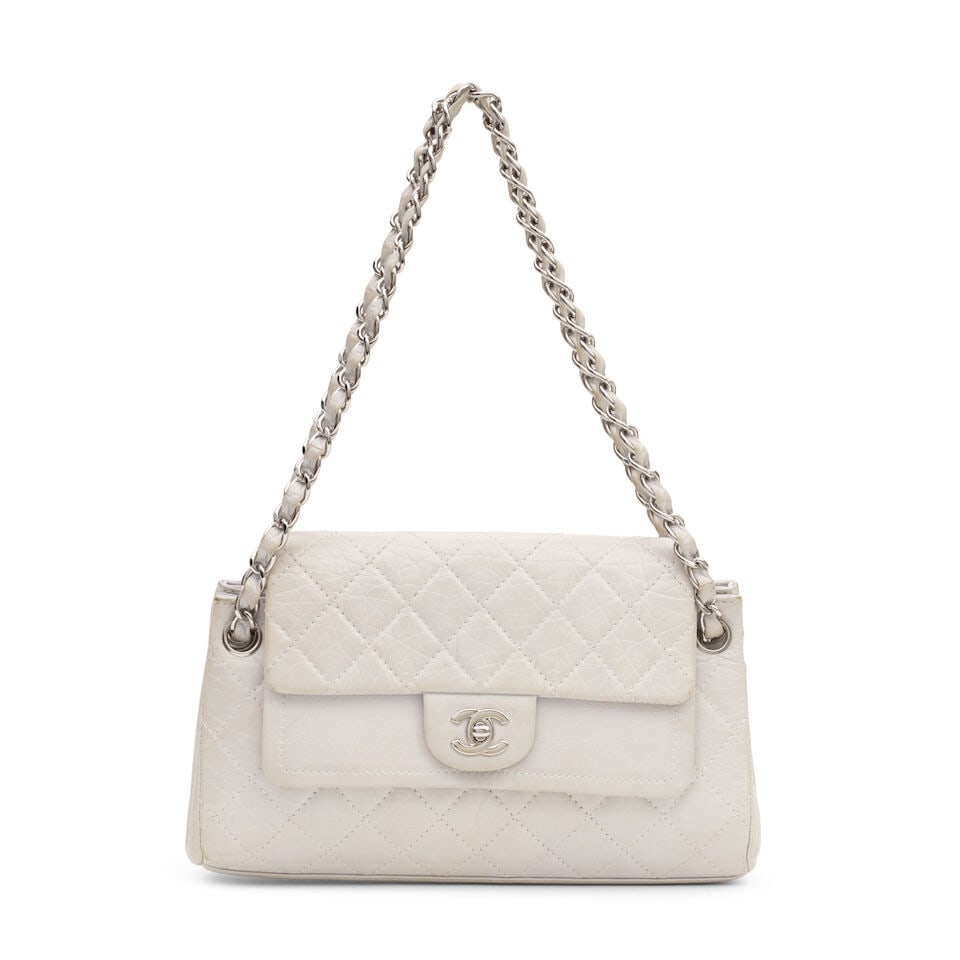 Chanel: a Pearl Grey Aged Calfskin Leather Flap Bag 2005-06 (includes serial sticker, authentici...: Chanel: a Pearl Grey Aged Calfskin Leather Flap Bag 2005-06 Creative Director: Karl Lagerfeld Double flap with silver tone hardware Condition Grade C- 28cm wide, 17.5cm high, 7cm deep, 22cm/41cm