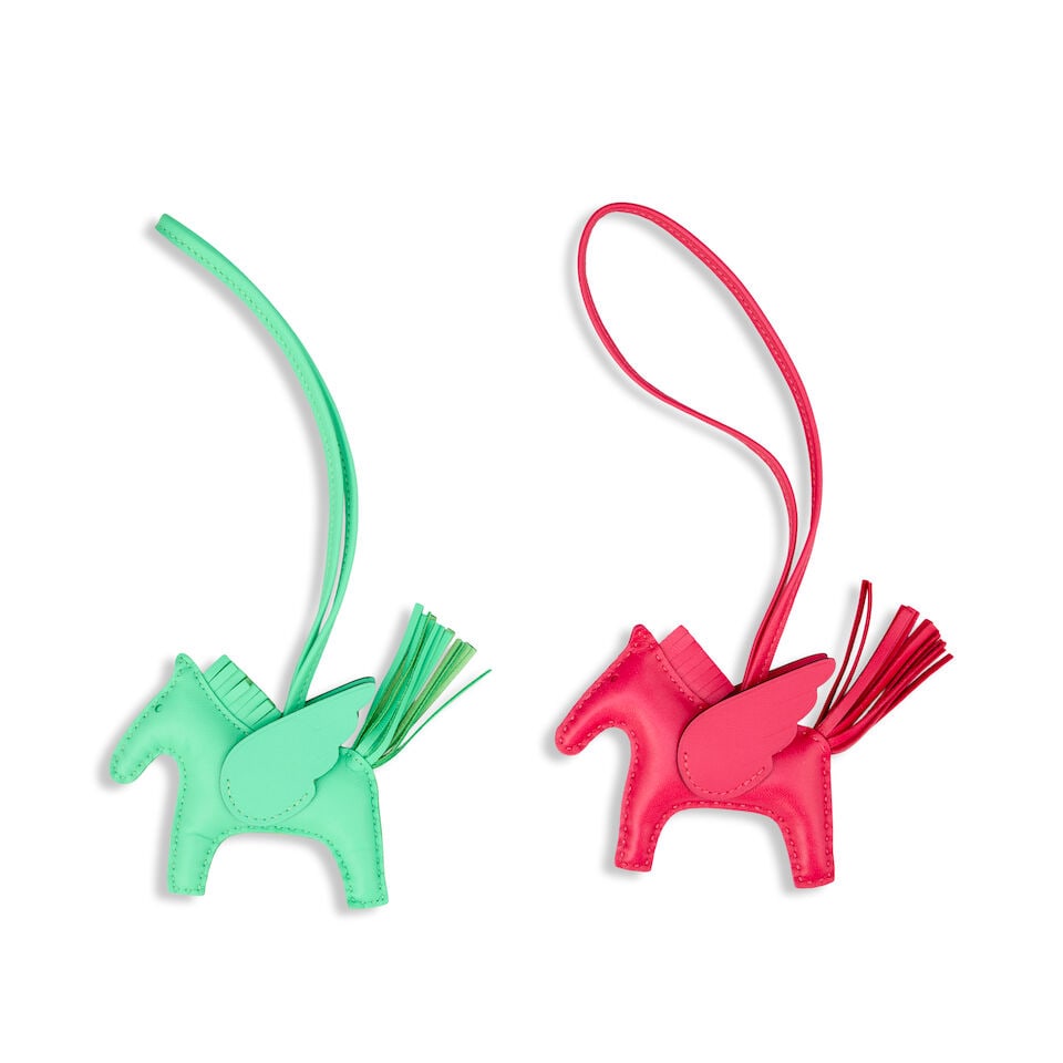 Hermès: Two Rodeo Pegase PM Charms 2023 (includes boxes): Hermès: Two Rodeo Pegase PM Charms 2023 Single colour Pegase charms, one in Framboise and the other in Vert Comics, (2) Condition Grade A Each approximately 9cm wide, 7cm high, includes