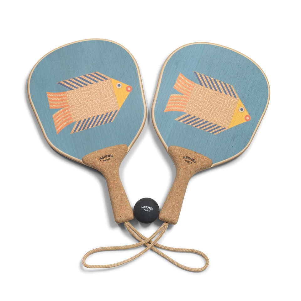 Hermès: a Set of Two Animaux Nattés Beach Rackets (includes dust bag and box): Hermès: a Set of Two Animaux Nattés Beach Rackets Printed beechwood and cork, rubber ball included, (3) Condition Grade A+ Each racket 40cm x 21cm, includes dust bag and box For further