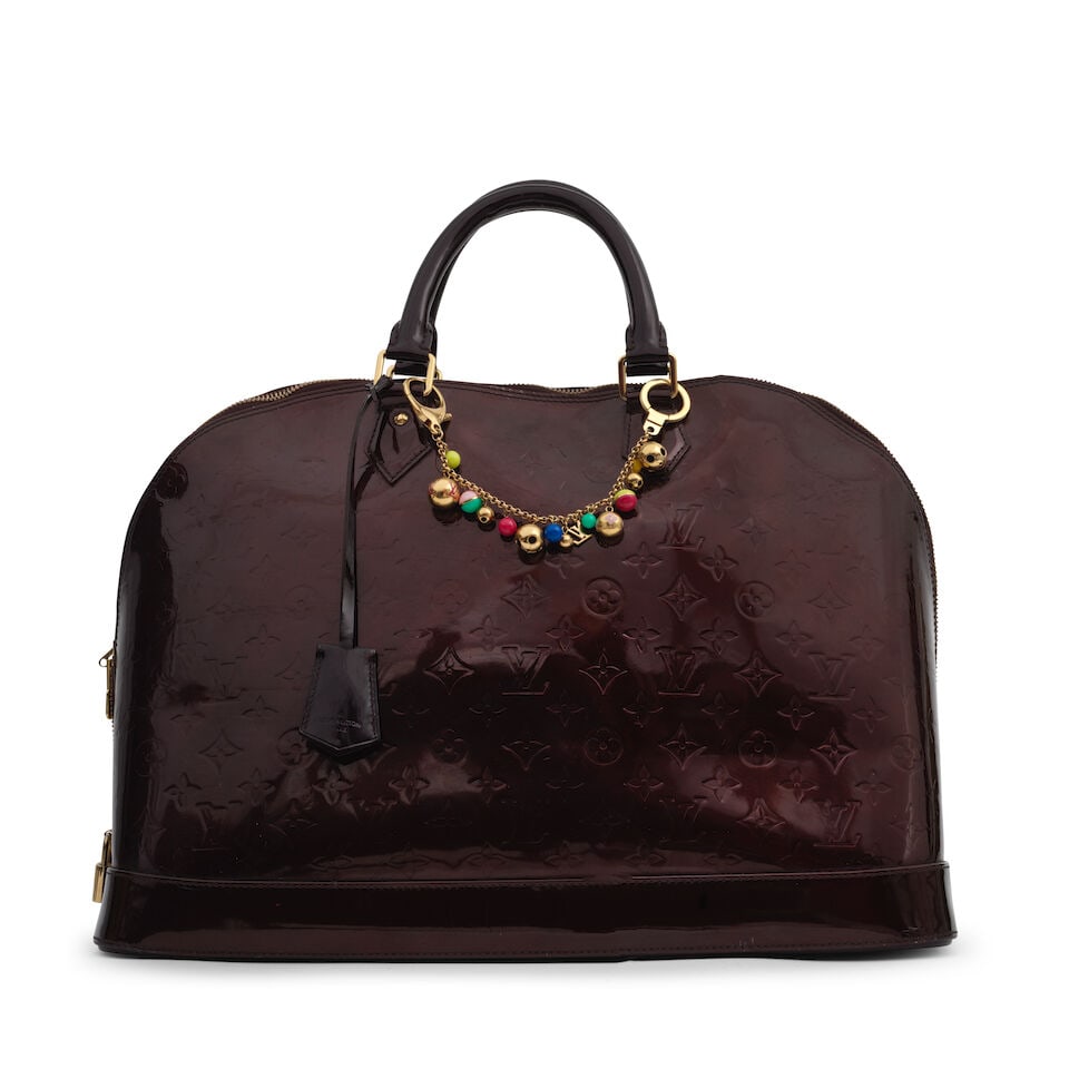 Louis Vuitton: an Amarante Vernis Monogram Alma GM: Louis Vuitton: an Amarante Vernis Monogram Alma GM Gold tone hardware, together with a Chaine Grelots keychain bag charm, (2) Condition Grade C 45cm wide, 35cm high, 22cm deep, 10cm handle drop Lot to
