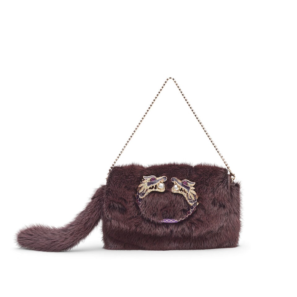 Gucci: a Purple Mink Fur Dragon Pearl Clutch Autumn/Winter 2004, Runway look 39 (includes dust bag): Gucci: a Purple Mink Fur Dragon Pearl Clutch Autumn/Winter 2004, Runway look 39 Creative Director: Tom Ford Purple mink fur with a double-headed enamelled dragon clasp, embellished with simulated pear