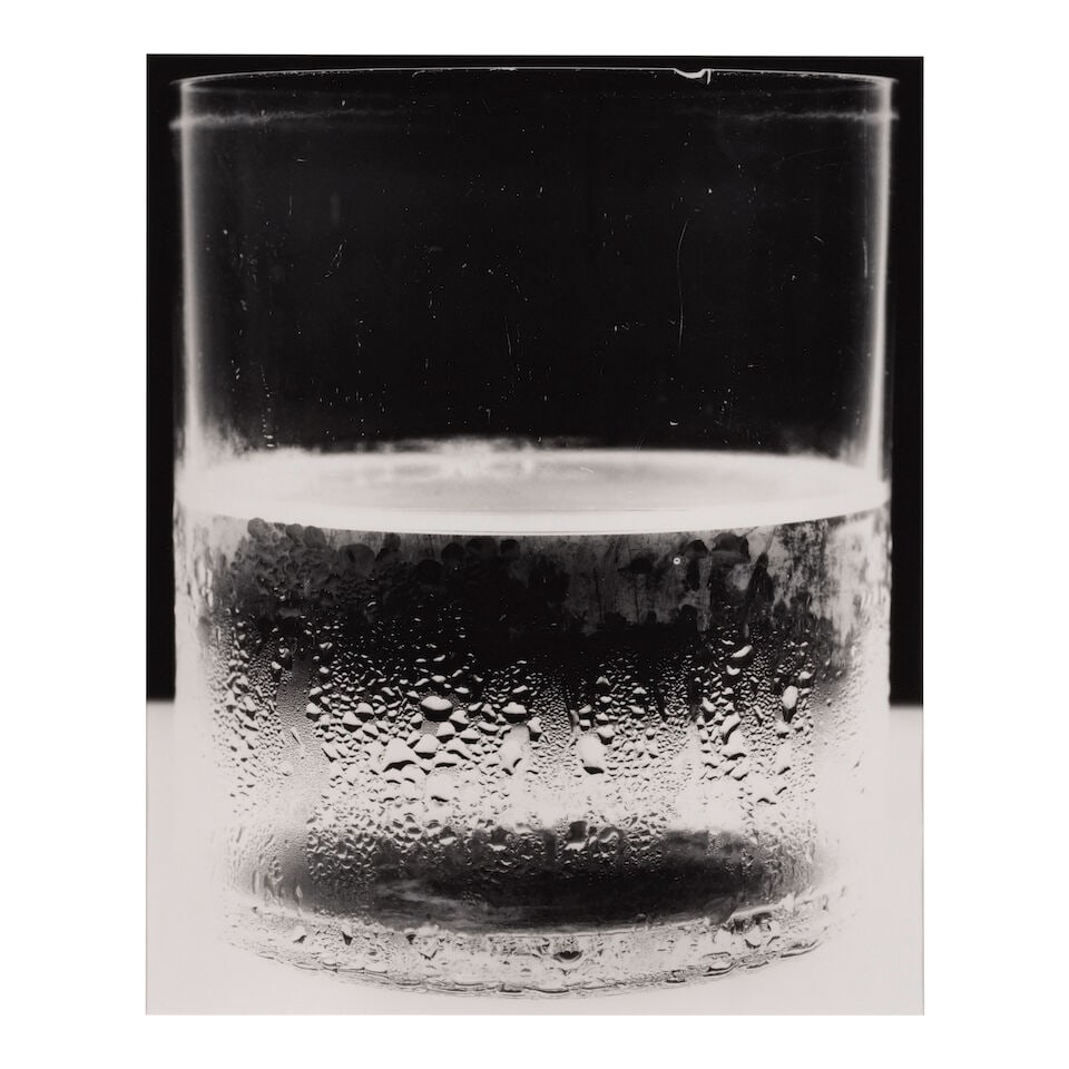 Amanda Means (born 1950); 'Water Glass 2, 2004 (variant)';: Amanda Means (born 1950) 'Water Glass 2, 2004 (variant)', 2004 Gelatin silver print, printed later; signed, titled, dated, annotated, and editioned '3/20' in pencil on the reverse, framed. 22 x 18 in.