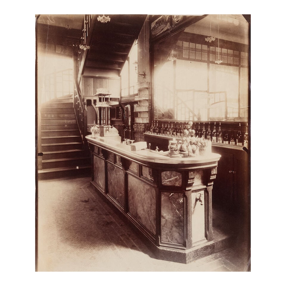 Eugène Atget (1857-1927); 'Md de Vin Rue Boyer' (Marchand de Vin);: Eugène Atget (1857-1927) 'Md de Vin Rue Boyer' (Marchand de Vin), 1910-11 Albumen print; numbered '261' in the negative, titled and numbered '261' in pencil on the reverse. 8 1/2 x 7 1/4 in. (21.