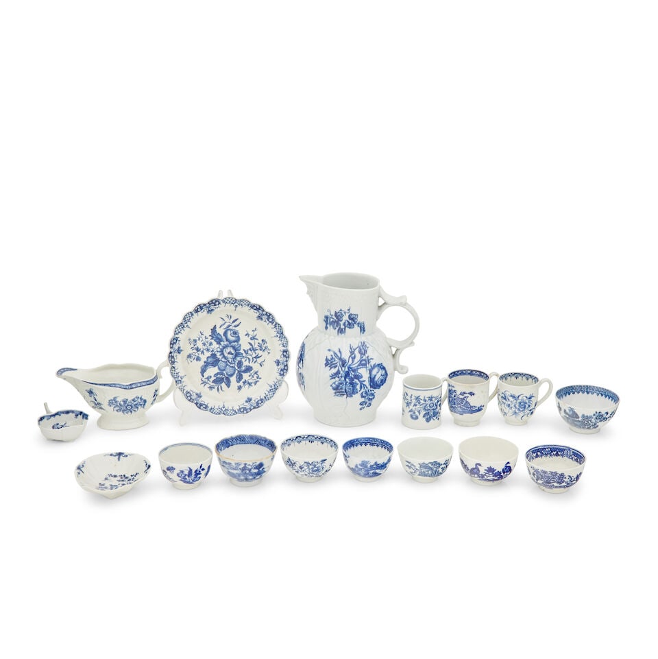 A Worcester blue and white porcelain cabbage leaf single handed jug Circa 1780: A Worcester blue and white porcelain cabbage leaf single handed jug Circa 1780 Painted with floral bouquets, crescent moon mark, 21cm high; together with a Worcester pine cone pattern lobed dish, 7.5c