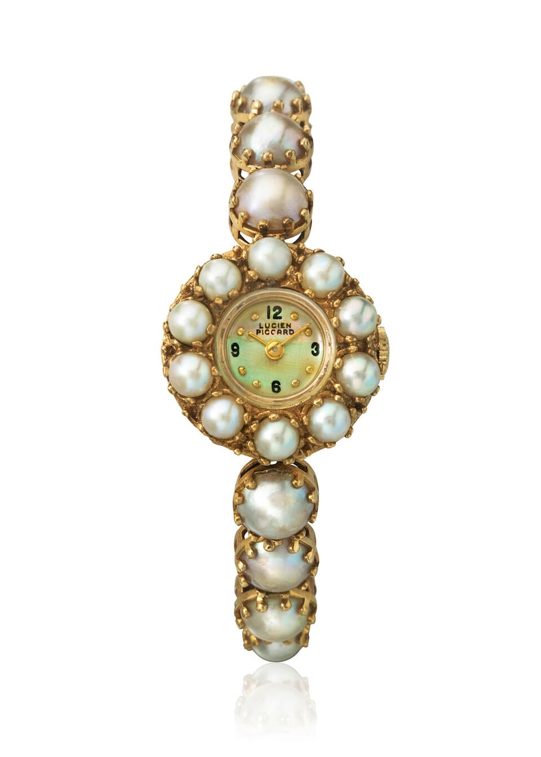 LUCIEN PICARD. A 14K GOLD FILLED MANUAL WIND BRACELET WATCH WITH MOTHER OF PEARL DIALc. 1970s (1 of 1)
