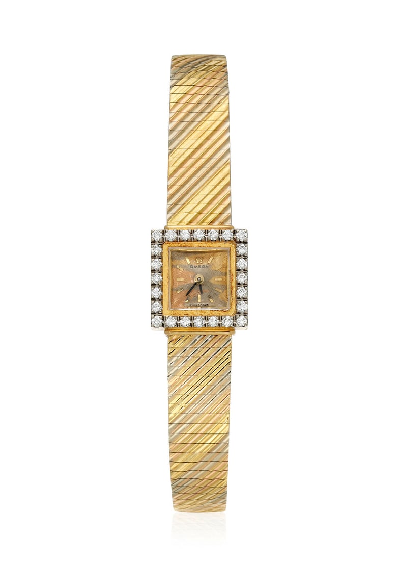 OMEGA. AN 18K GOLD DIAMOND SET BACKWIND BRACELET WATCHC. 1960s (1 of 1)