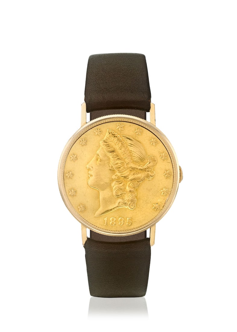 FAVRE LEUBA. AN 18K GOLD MANUAL WIND TWENTY DOLLAR COIN WRISTWATCH WITH CONCEALED DIALc. 1960s: FAVRE LEUBA. AN 18K GOLD MANUAL WIND TWENTY DOLLAR COIN WRISTWATCH WITH CONCEALED DIAL Date: c. 1960s Movement: 15-jewel manual wind Dial: Silvered Case: Round, snap on case back, no.