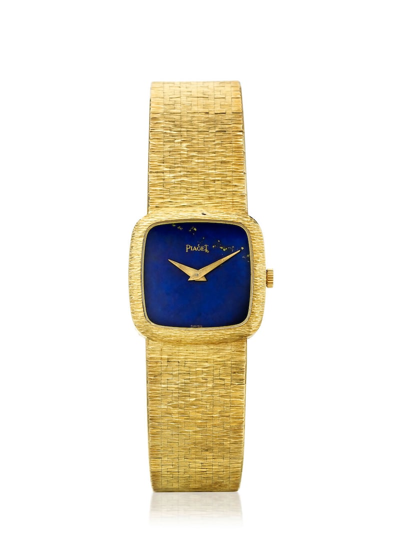 PIAGET. AN 18K GOLD MANUAL WIND BRACELET WATCH WITH LAPIS LAZULI DIALRef: 9902 A6, c. 1975: PIAGET. AN 18K GOLD MANUAL WIND BRACELET WATCH WITH LAPIS LAZULI DIAL Reference: 9902 A6 Date: c. 1975 Movement: Cal. 9P1, 18-jewel manual wind, no. 7317501 Dial: Lapis lazuli Case: Cushion form, case