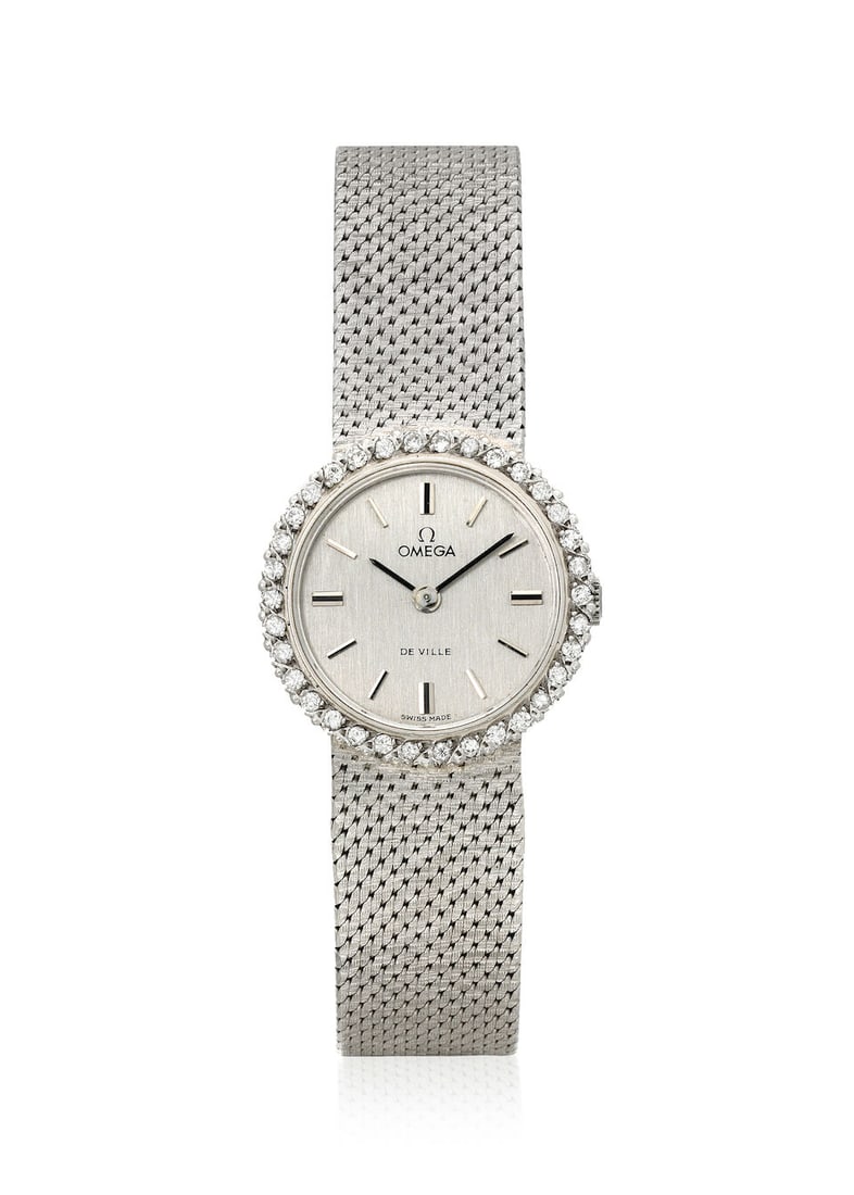 OMEGA. AN 18K GOLD DIAMOND SET MANUAL WIND BRACELET WATCH De Ville, c. 1960s (1 of 1)