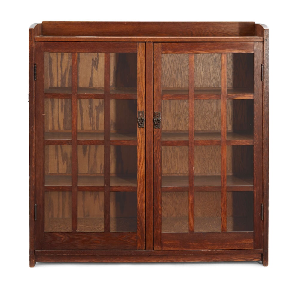 GUSTAV STICKLEY (1858-1942) DOUBLE-DOOR BOOKCASE NO. 718 Eastwood, New York, c. 1905, oak, coppe... (1 of 1)