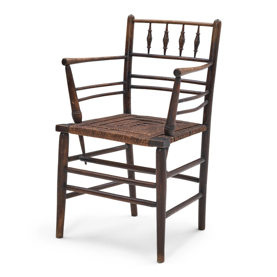 MORRIS & CO. 'SUSSEX' ARMCHAIR England, c. 1865, design attributed to Philip Webb, ebonized wood...: MORRIS & CO. 'SUSSEX' ARMCHAIR England, c. 1865, design attributed to Philip Webb, ebonized wood, rush seat woven in a geometric design, unmarked, ht. 33, seat ht. 17 1/2, wd. 21, dp. 17 in. Lot to be