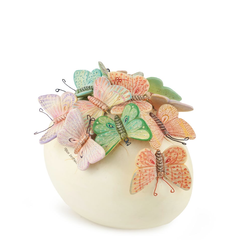 SERGIO BUSTAMANTE (B. 1949) EGG WITH BUTTERFLIES SCULPTURE Mexico, c. 2000, glazed ceramic, wire...: SERGIO BUSTAMANTE (B. 1949) EGG WITH BUTTERFLIES SCULPTURE Mexico, c. 2000, glazed ceramic, wire, signed 'Sergio Bustamante,' ht. 7 1/4, wd. 9, dp. 7 1/2 in. For further information on this lot please