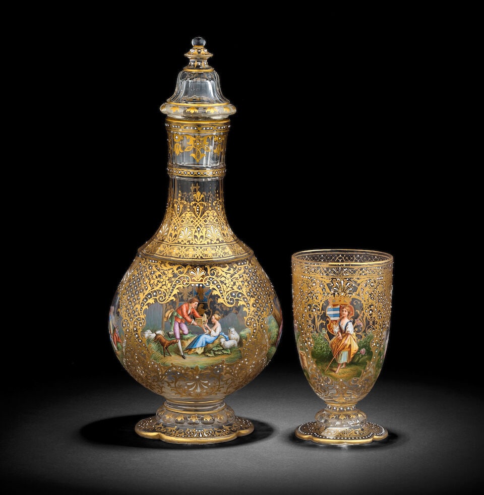 A fine Lobmeyer gilded and enamelled decanter and stopper, and a goblet, circa 1893 - 4