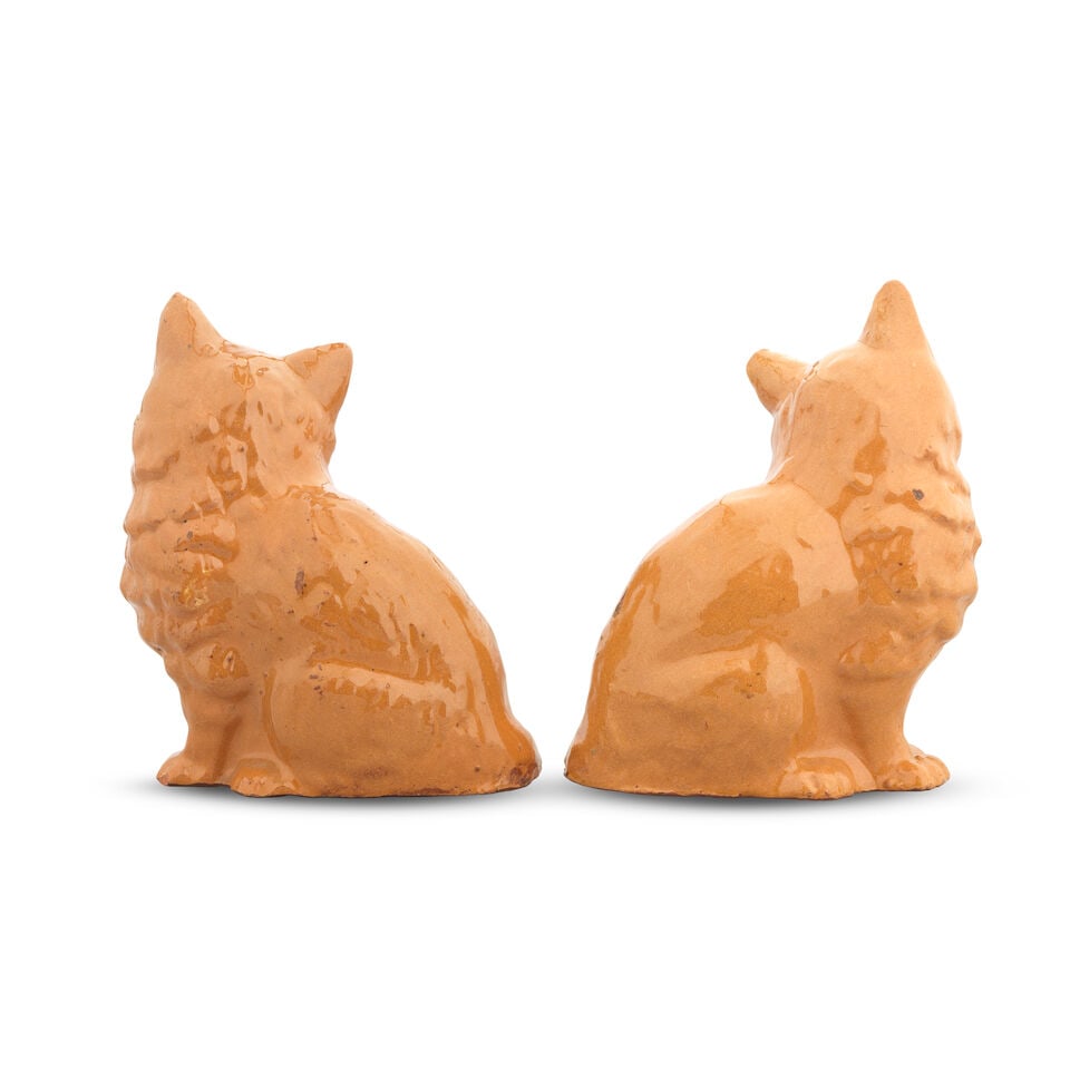 A good pair of Ewenny (Clay Pits) slipware models of cats, circa 1900 - 2