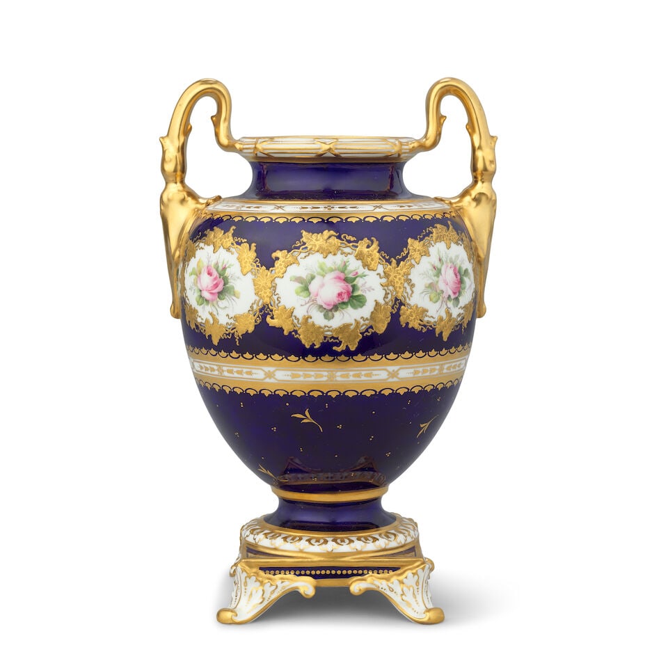 A fine Royal Crown Derby vase by George Darlington, dated 1919: A fine Royal Crown Derby vase by George Darlington, dated 1919 Of ovoid shape with high gilt handles, raised on a square foot with scrolled feet heightened in gold, finely painted with a continuous bo