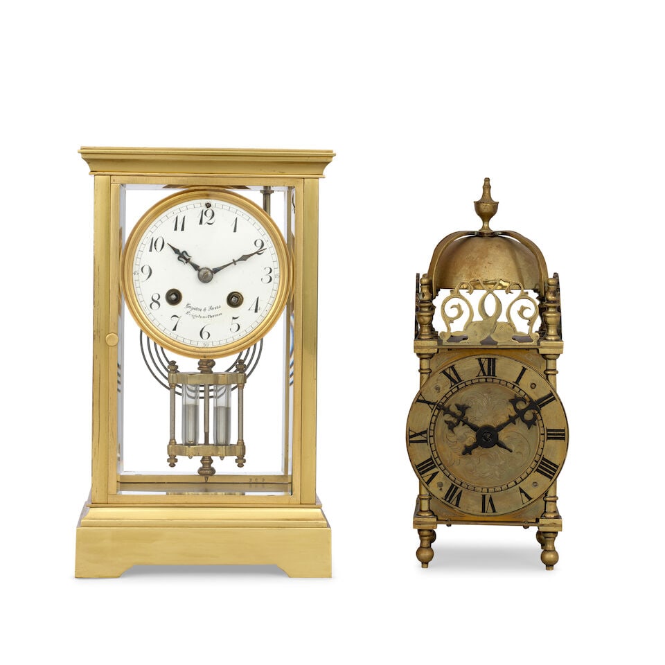 A early 20th century French four glass mantle clock and a first quarter of the 20th century bras... (1 of 4)