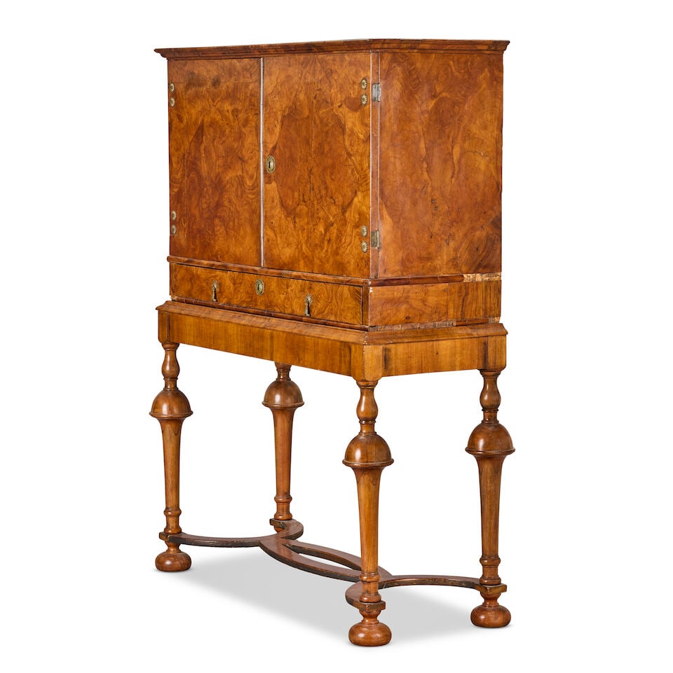 A Charles II olivewood cabinet on a later walnut stand The cabinet: circa 1680; the stand probab... - 2