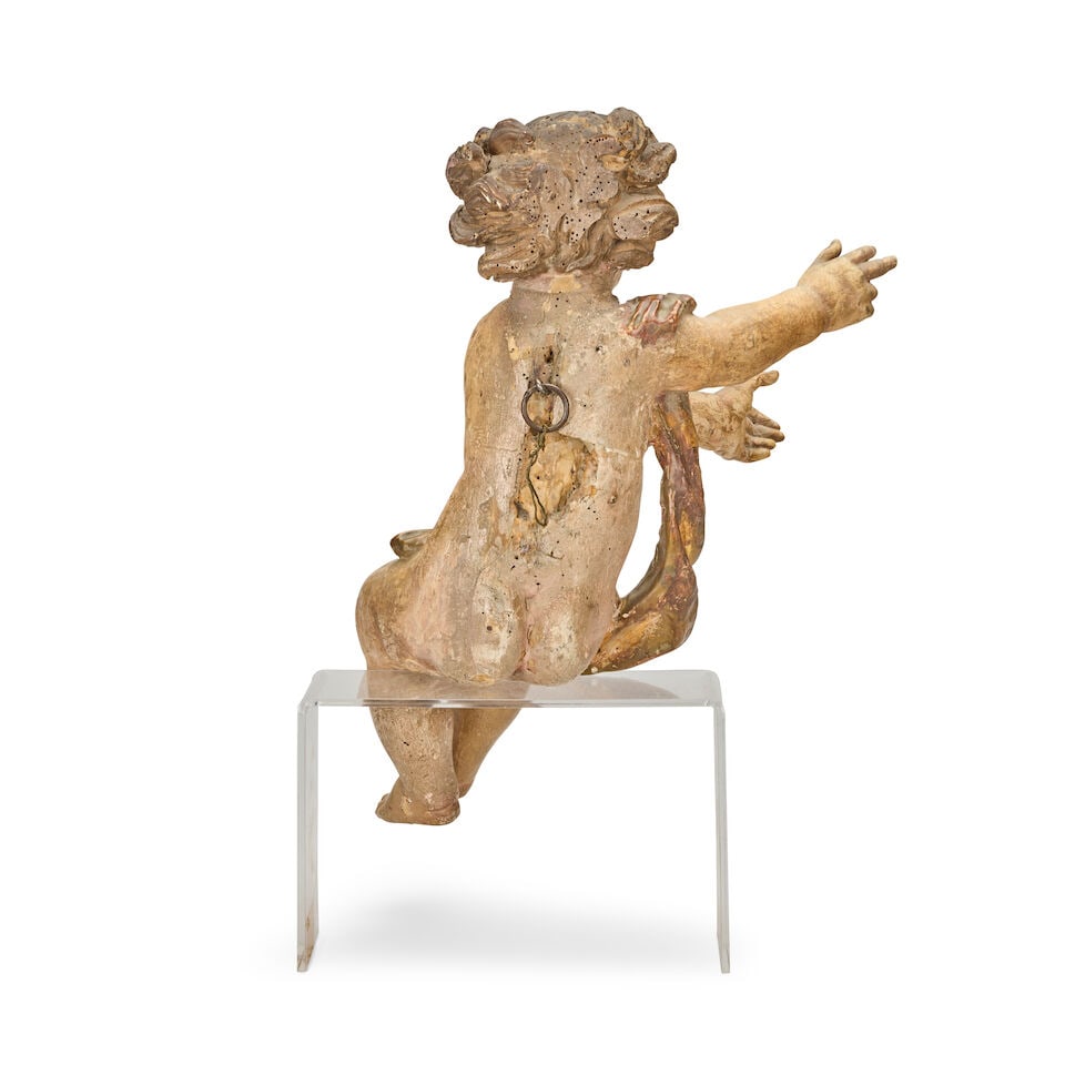 A Continental carved and polychrome decorated wood figure of a putto Probably South German, late... - 2