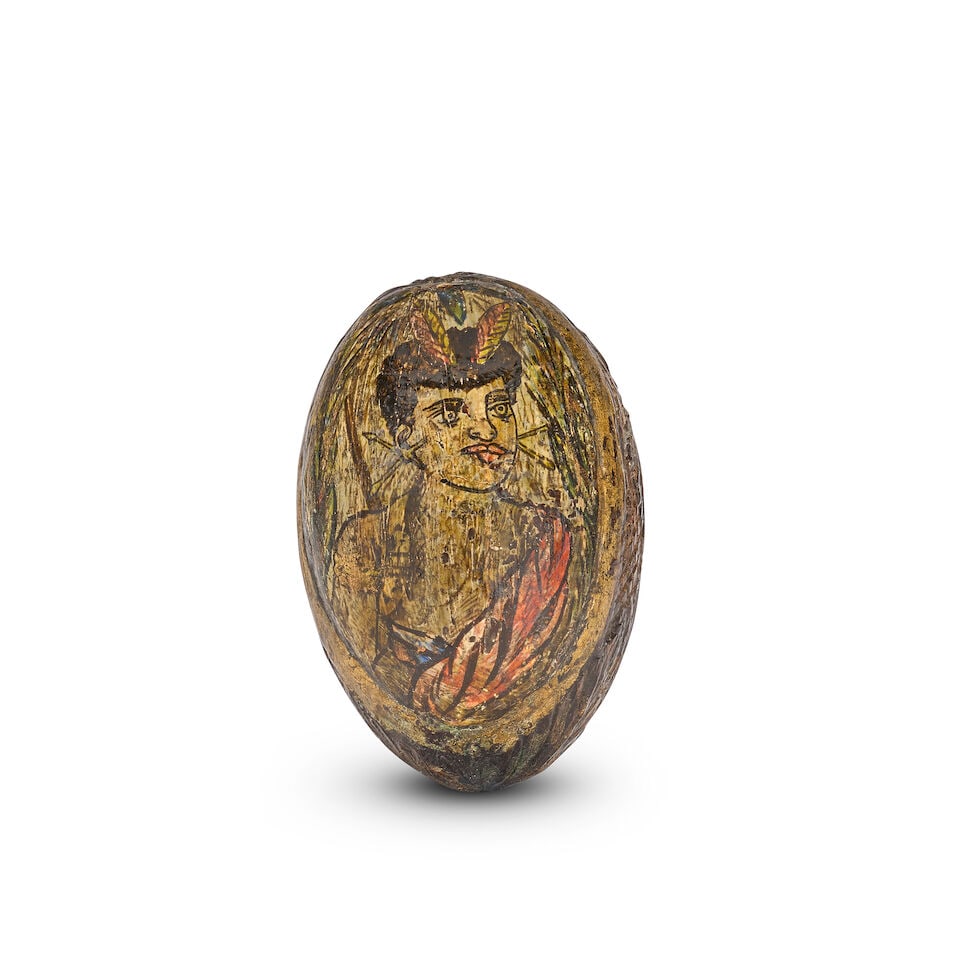 OF ETHNOGRAPHIC INTEREST: An unusual 19th century colonial carved and polychrome decorated cocon... - 2