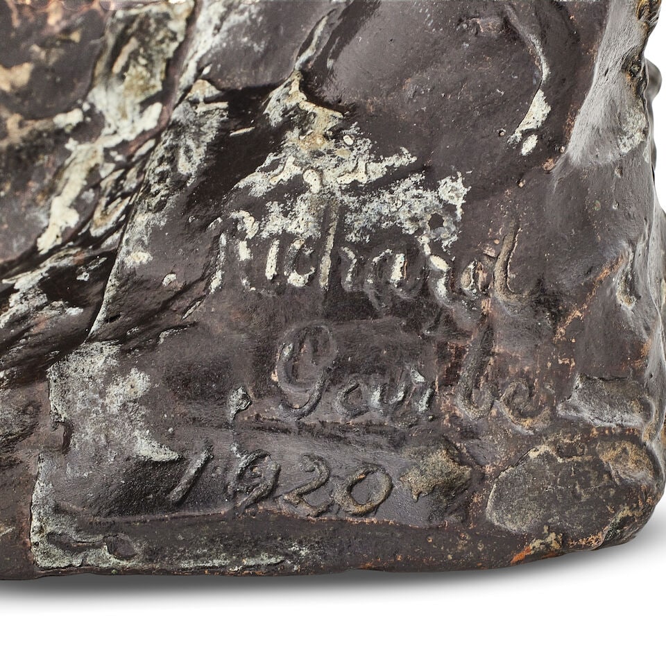 Richard Garbe (British, 1876-1957): A patinated bronze group of two monkeys sat on the head of a... - 2