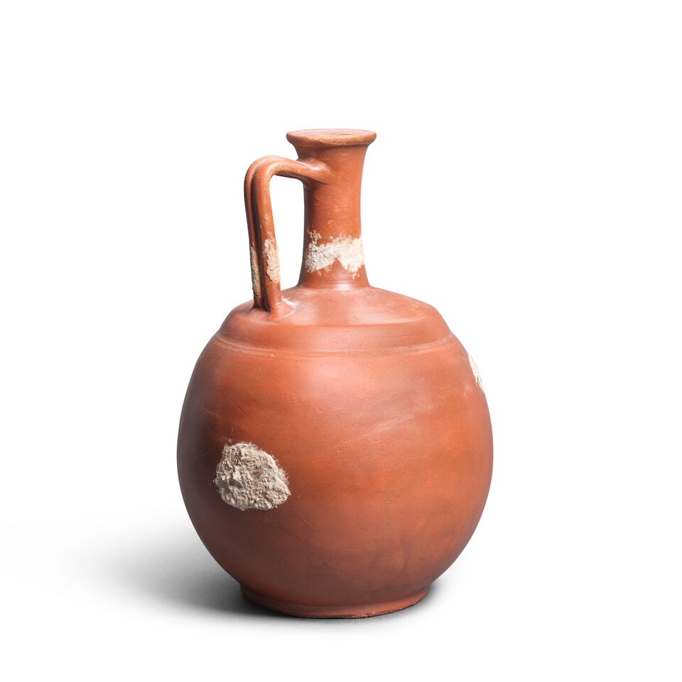 A Roman-style red slip ware jug - 2