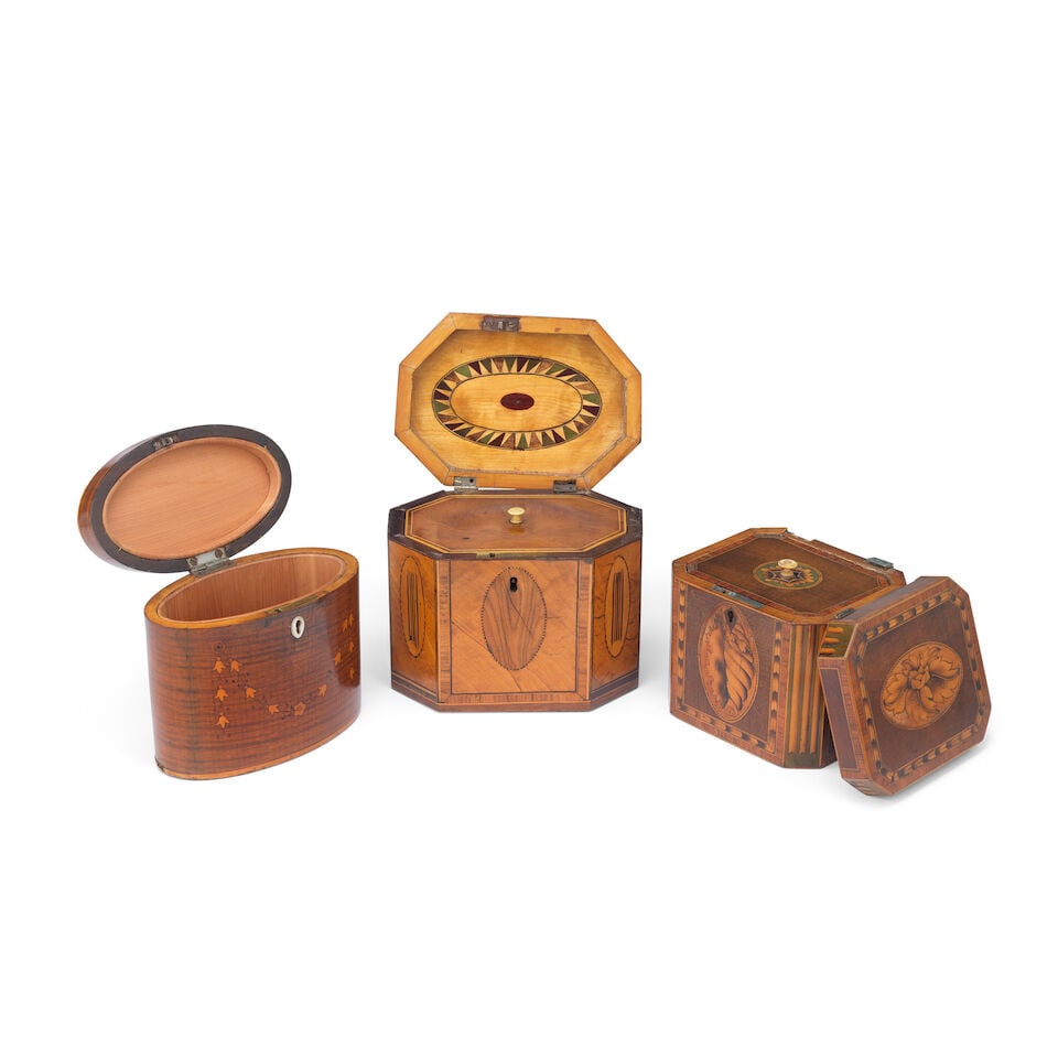 A George III oval marquetry inlaid mahogany tea caddy together with two other similar period mar... - 2