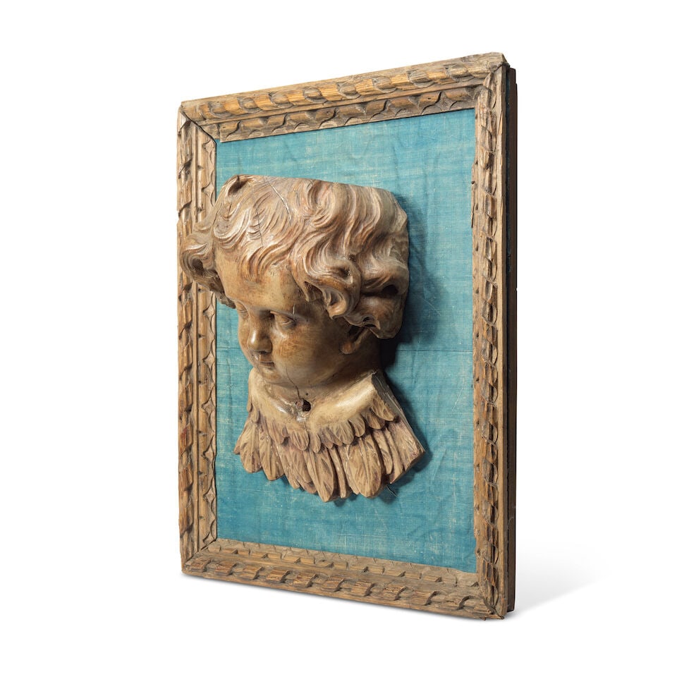 A carved fruitwood bust relief of putto Probably 18th century - 2