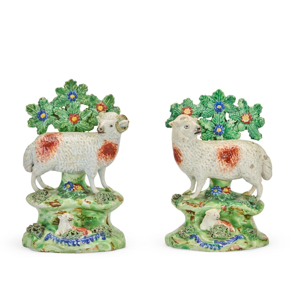A pair of early 19th century Staffordshire pearlware models of a ewe and a ram By John Walton, ... (1 of 2)