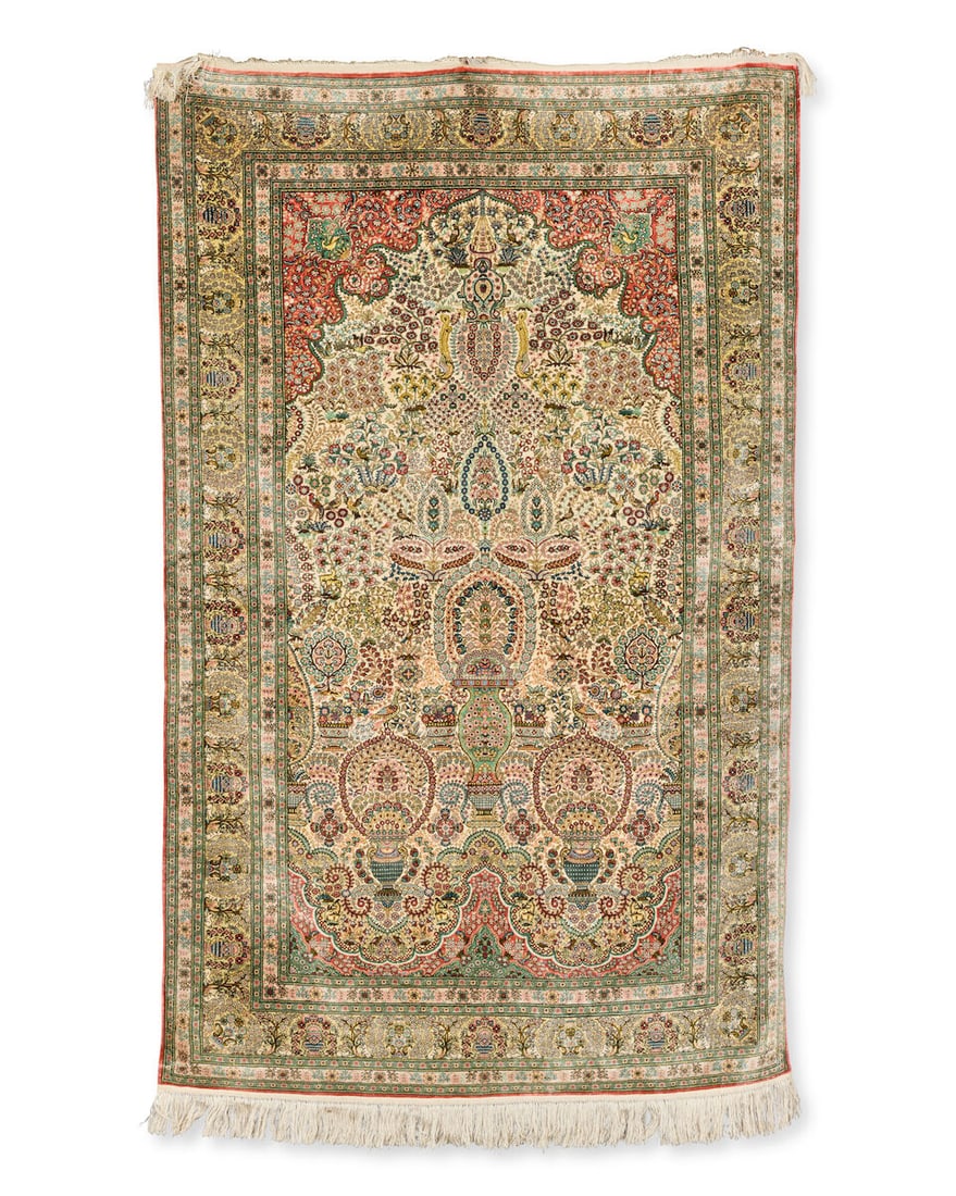 A silk Hereke rug West Anatolia, 156cm x 95cm: A silk Hereke rug West Anatolia, With typical niche design, filled with delicate floral motifs and enclosed by elaborate border, 156cm x 95cm This lot is subject to the following lot symbols: TP TP