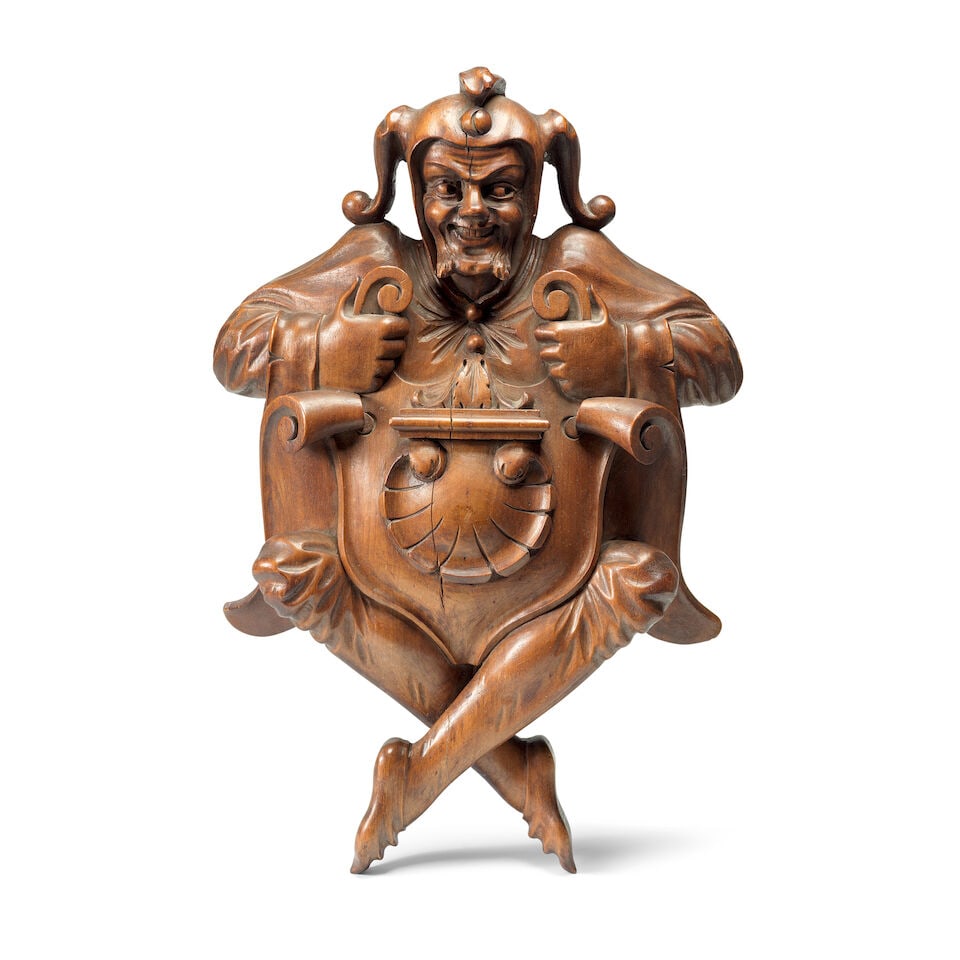 A carved oak decorative mount in the form of a court jester (1 of 2)