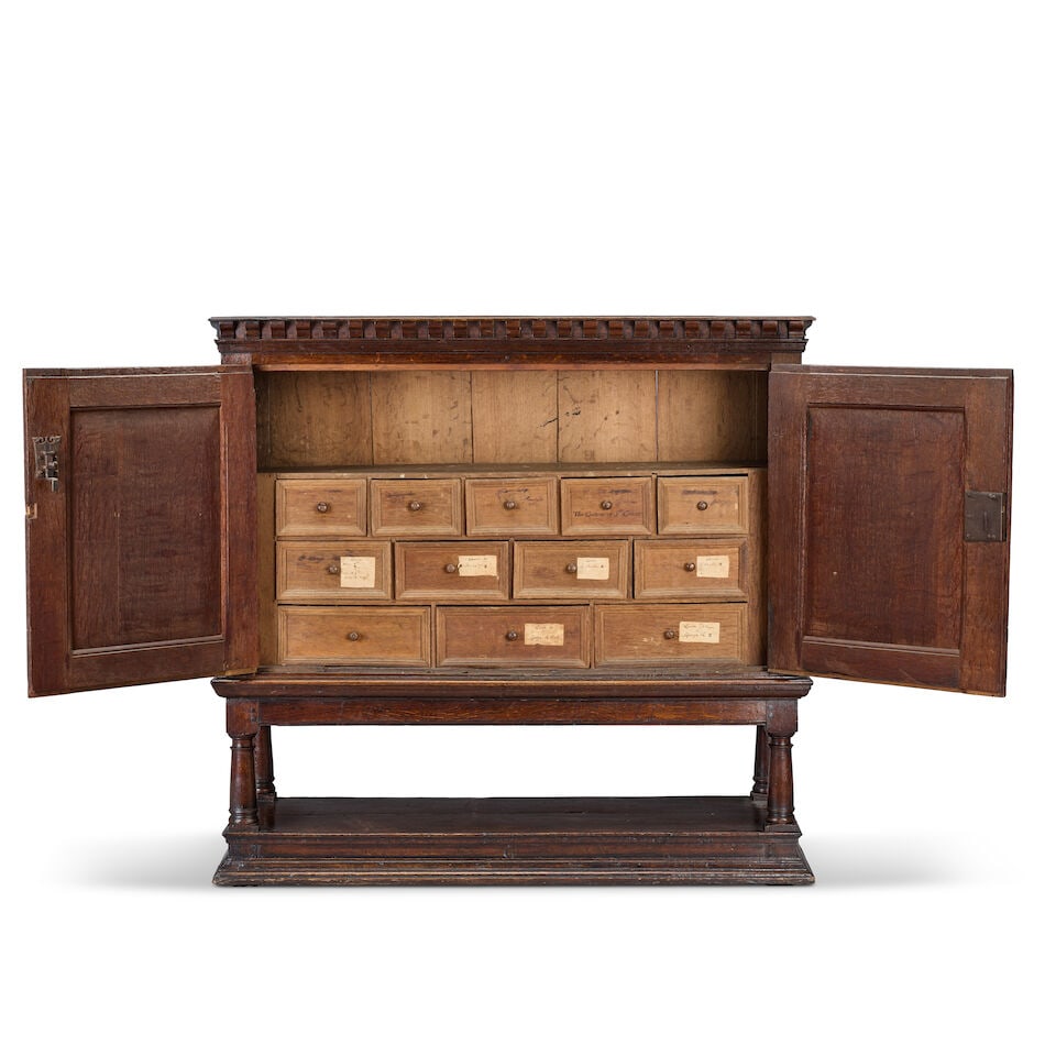 An oak 'Estate' cupboard on stand Parts 17th century, but largely later in date - 3