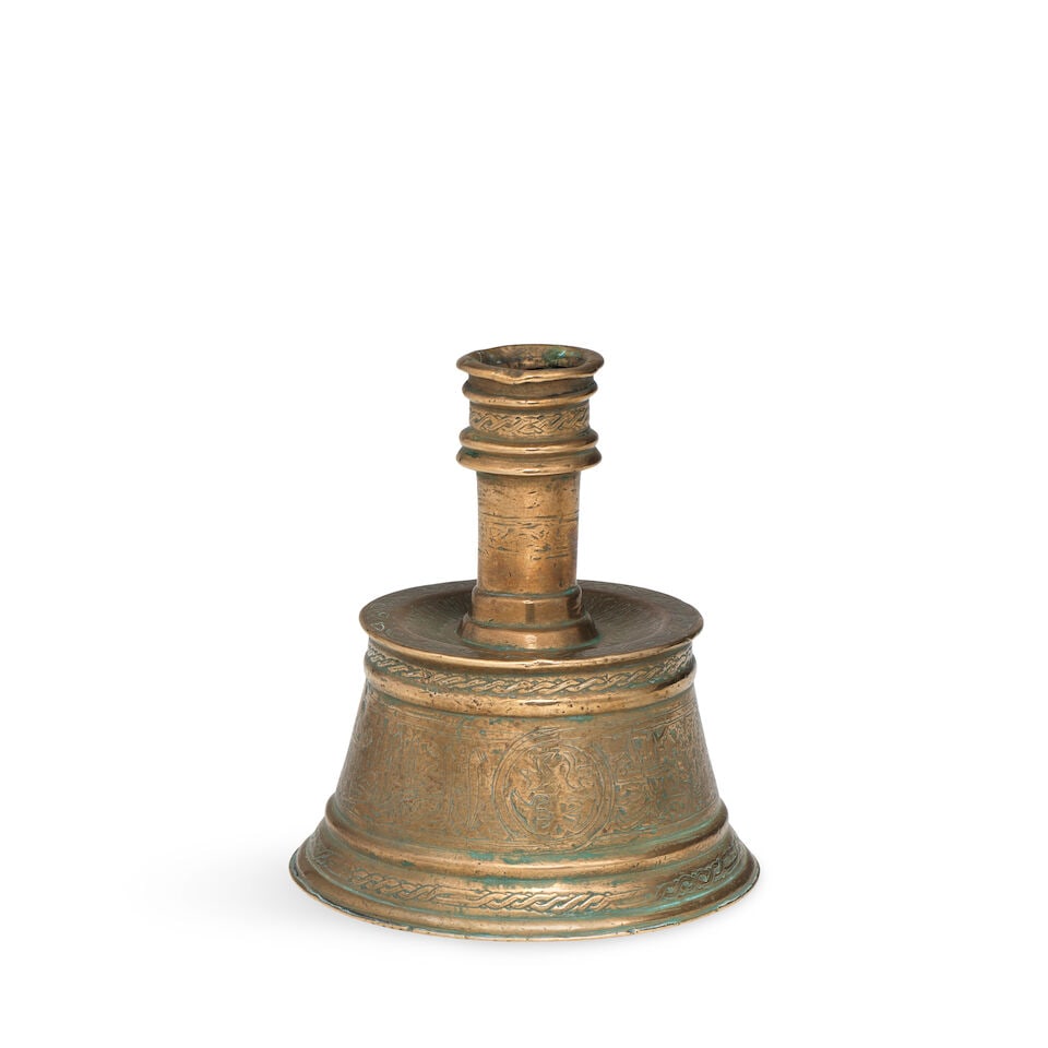 A Mamluk brass candlestick Egypt, 13th/ 14th Century (1 of 2)