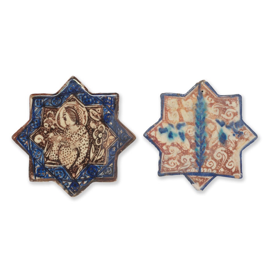 Two Kashan lustre pottery star tiles Persia, 13th Century: Two Kashan lustre pottery star tiles Persia, 13th Century each with eight points, decorated in cobalt blue and a brownish gold lustre on a cream ground, the first with a central panel containing a fig