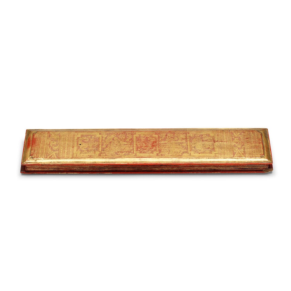Sixteen gilt and lacquer leaves, and two gilded wood cover-boards, from a Kammavaca religious ma... - 2