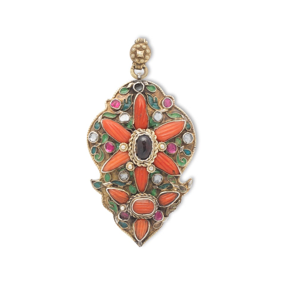 An Ottoman coral and garnet-set enamelled silver-gilt buckle element later mounted as a brooch T...: An Ottoman coral and garnet-set enamelled silver-gilt buckle element later mounted as a brooch Turkey, late 18th/ early 19th Century of lobed form, set with coral (corallium rubrum), garnet and paste,