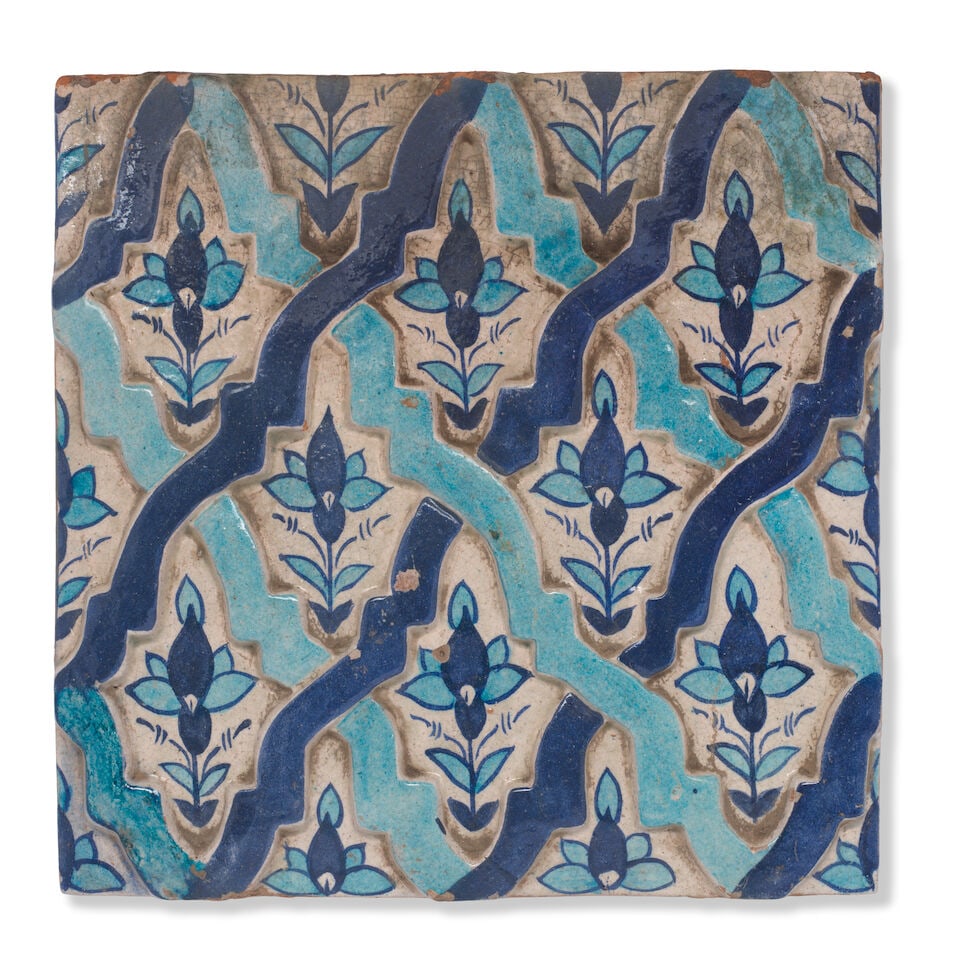 A Multan underglaze-painted moulded pottery tile North India, 19th/ 20th Century (1 of 2)