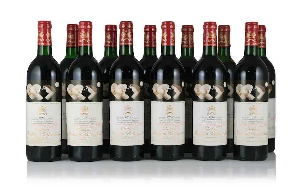 Château Mouton Rothschild, 1986 (12 x 750ml): Château Mouton Rothschild, 1986 (12 x 750ml) Region: Pauillac Fill Level: 4 into neck, 5 very top, 2 top, 1 high shoulder Capsule: 3 nicked capsules, 1 torn & slightly corroded, 2 faded Label: li