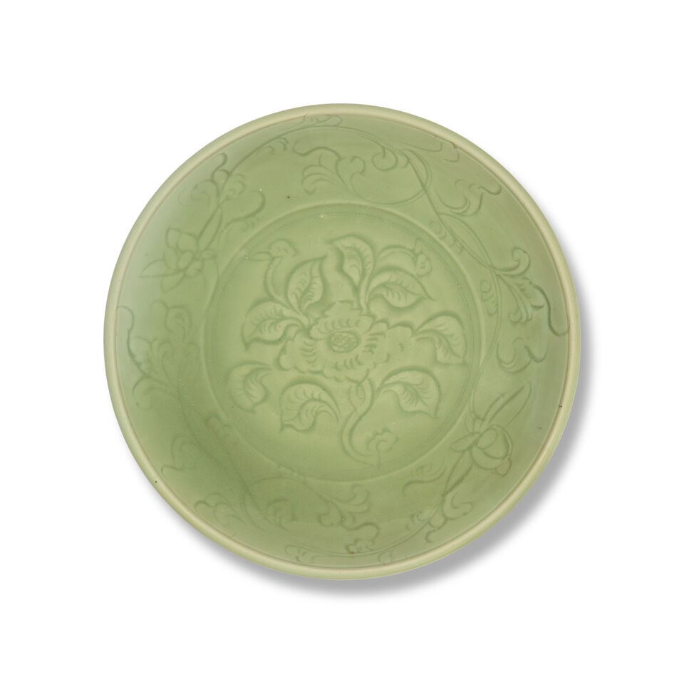 A LONGQUAN CELADON CARVED 'FLORAL' DISH Ming Dynasty, 15th century (1 of 3)
