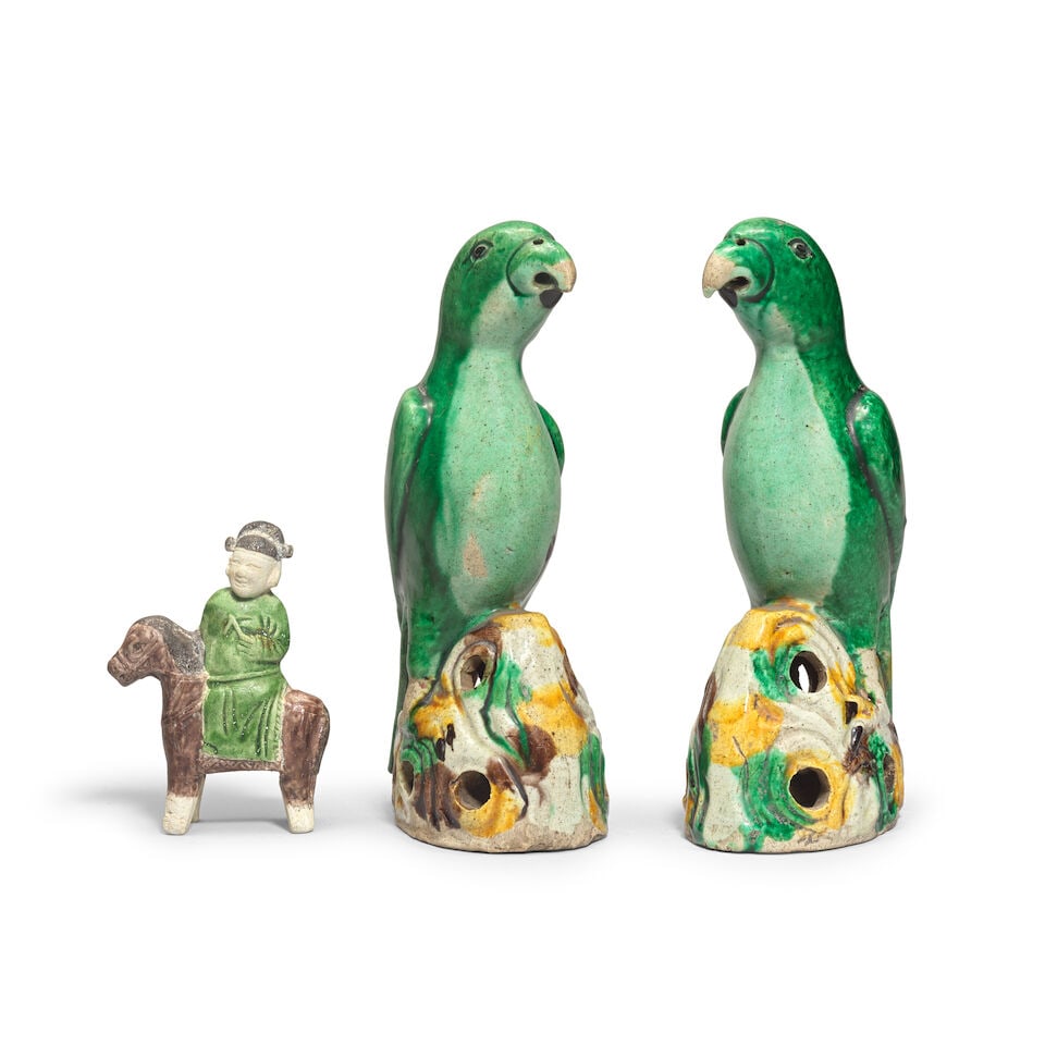 A PAIR OF FAMILLE VERTE BISCUIT MODELS OF PARROTS AND A SMALL GLAZED BISCUIT MODEL OF A SCHOLAR ... (1 of 2)