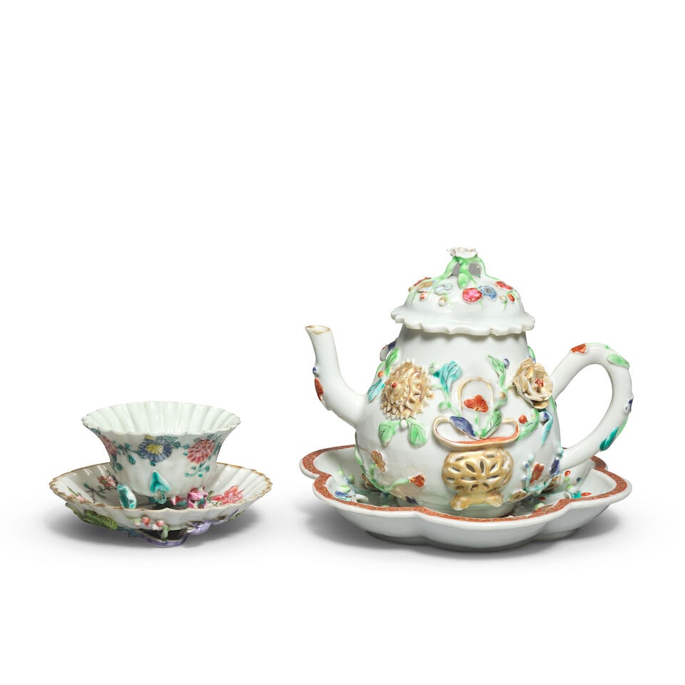 A MOULDED FAMILLE ROSE TEAPOT, COVER AND STAND, AND A CUP AND A SAUCER Yongzheng (5) (1 of 3)