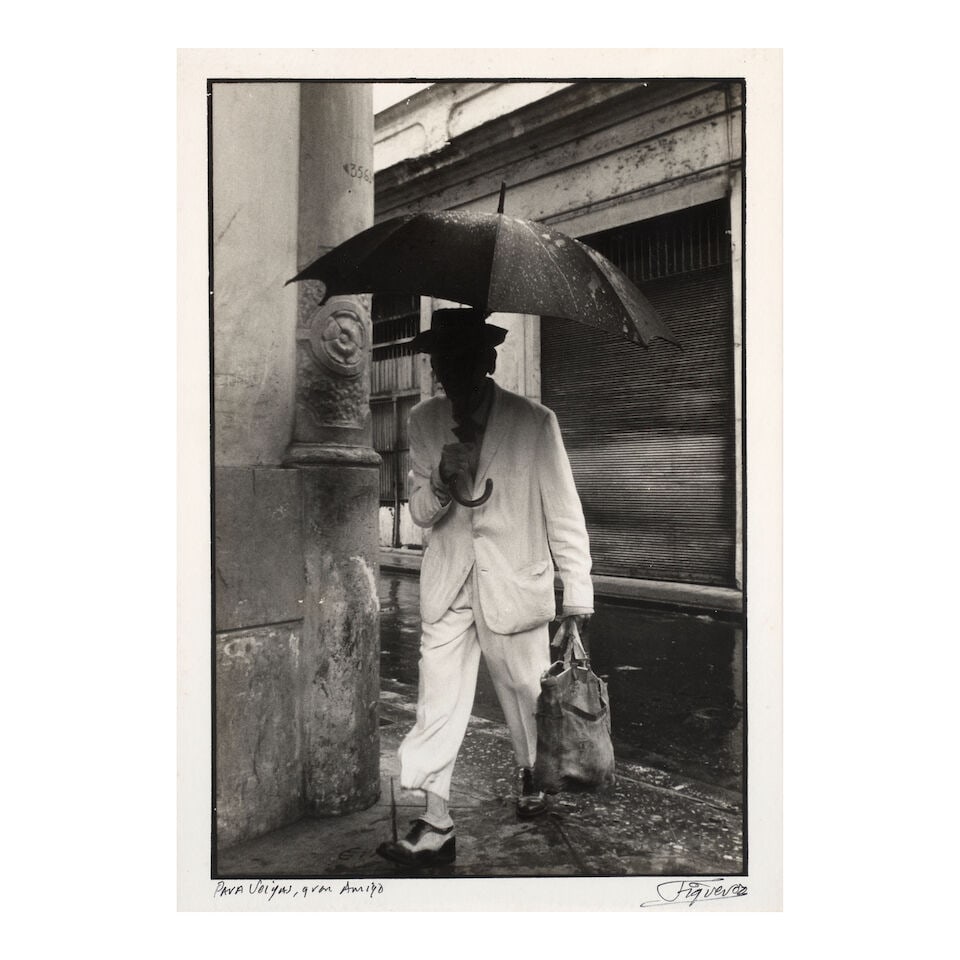 JOSÉ ALBERTO FIGUEROA (B. 1946) Reina Street, Havana (from the series Compatriots) 13 3/8 x...: JOSÉ ALBERTO FIGUEROA (B. 1946) Reina Street, Havana (from the series Compatriots) signed 'Figueroa' (lower right); inscribed 'Para Veigas, gran Amigo' (lower left) gelatin silver print 13 3/8 x