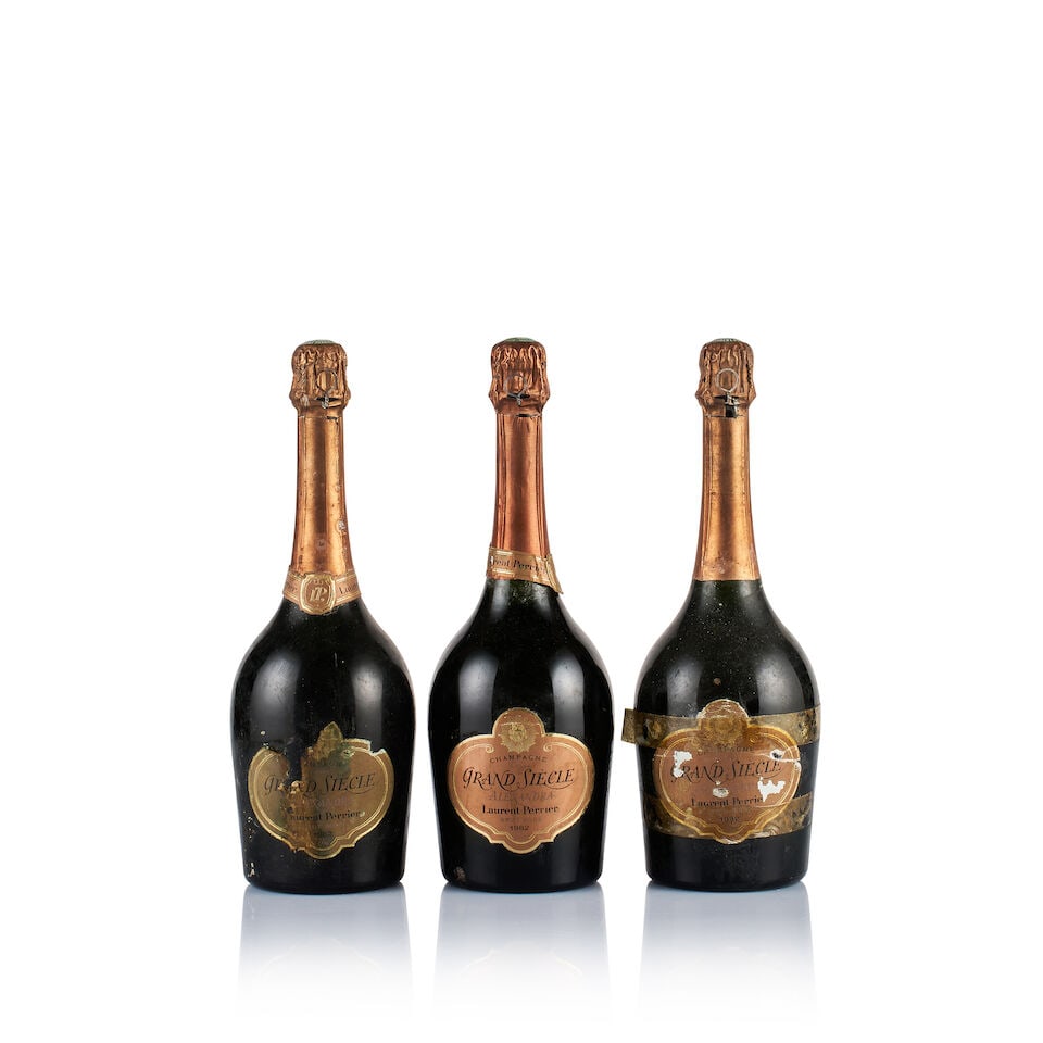 Champagne Laurent Perrier, Alexandra Brut Rosé, 1982 (3 x 750ml): Champagne Laurent Perrier, Alexandra Brut Rosé, 1982 (3 x 750ml) Region: Champagne Fill Level: excellent Capsule: 3x bin-soiled and slightly corroded Cork: ok Label: 1x bin-soiled and stained, 1x