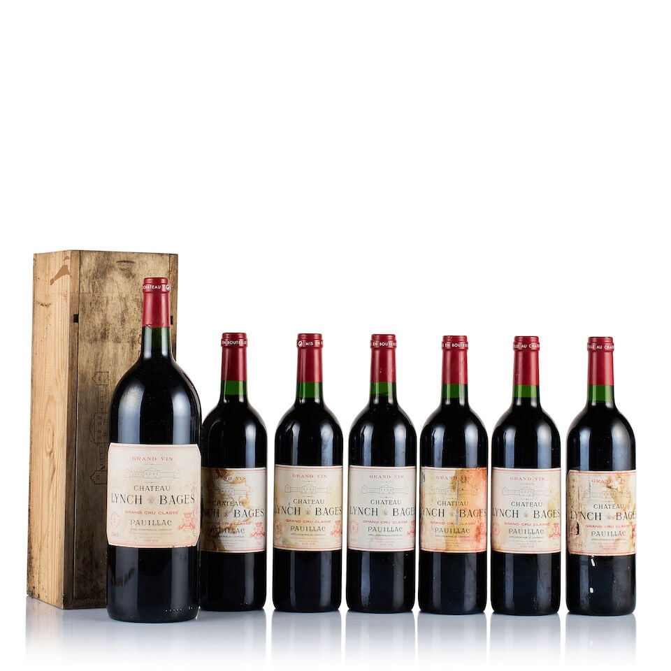 Château Lynch Bages, Pauillac, Grand Cru Classé, 2001 & 2003 (6 x 750ml & 1 x Magnum): Château Lynch Bages, Pauillac, Grand Cru Classé, 2001 (1 x Magnum) Region: Bordeaux Fill Level: into neck Capsule: ok Cork: ok Label: stained Packaging: individual original wooden case Ch&#