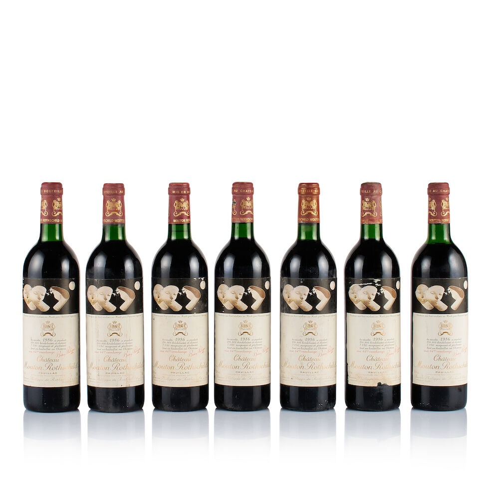 Château Mouton Rothschild, Pauillac, 1er Grand Cru Classé, 1986 (7 x 750ml): Château Mouton Rothschild, Pauillac, 1er Grand Cru Classé, 1986 (7 x 750ml) Region: Bordeaux Fill Level: 6x base of neck, 1x top shoulder Capsule: all corroded, bin-soiled and stained, 1x ba
