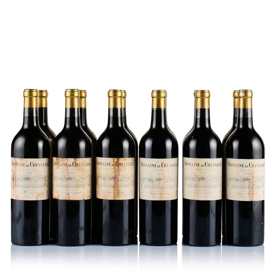 Domaine de Chevalier, Pessac-Léognan, Grand Cru Classé, White, 2005 (12 x 750ml): Domaine de Chevalier, Pessac-Léognan, Grand Cru Classé, White, 2005 (12 x 750ml) Region: Bordeaux Fill Level: into neck Capsule: ok Cork: ok Label: 12x badly bin-soiled, badly stained and ni