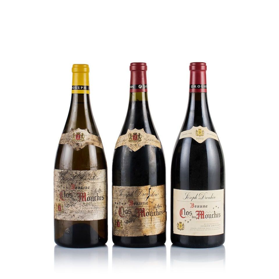 Joseph Drouhin, Beaune 1er Cru, Clos des Mouches, 2003 & 2012 (3 x Magnum): Joseph Drouhin, Beaune 1er Cru, Clos des Mouches White, 2003 (1 x Magnum) Region: Burgundy Fill Level: under 1.5cm below base of capsule Capsule: ok Cork: very slightly depressed Label: badly stained
