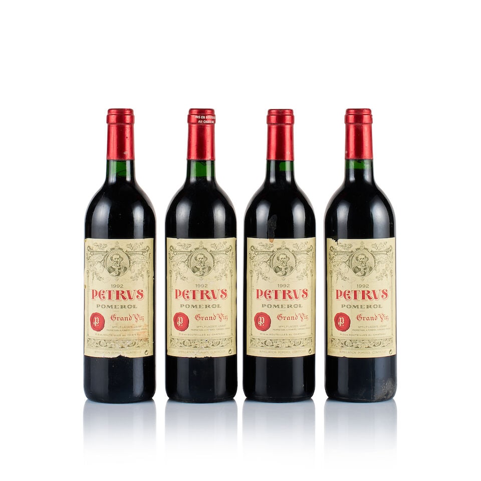 Pétrus, Pomerol, 1992 (4 x 750ml): Pétrus, Pomerol, 1992 (4 x 750ml) Region: Bordeaux Fill Level: into neck Capsule: ok Cork: ok Label: all slightly bin-soiled, 1x stained, 1x very slightly stained, 2x slightly marked and nicked P