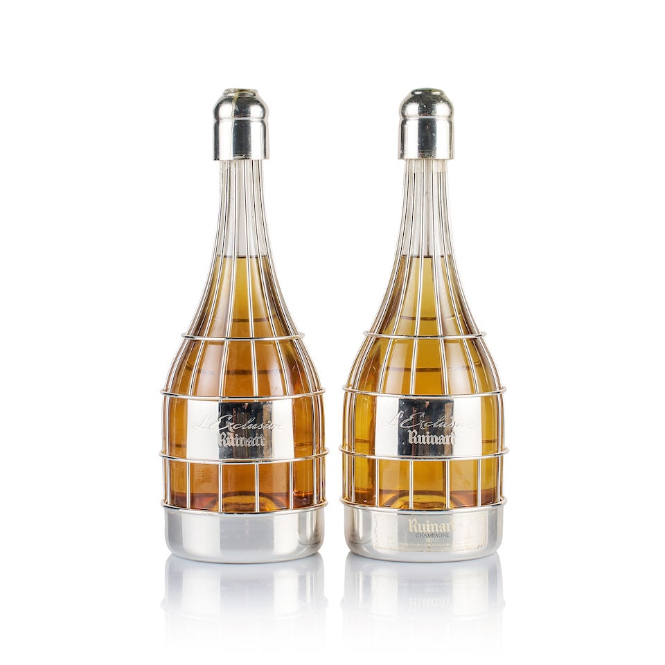 Champagne Ruinart, L'Exclusive (2 x Magnum): Champagne Ruinart, L'Exclusive (2 x Magnum) Region: Champagne Fill Level: 2x under 8cm below base of cork Capsule: ok Cork: ok Label: good appearance Packaging: individual original wooden presentation