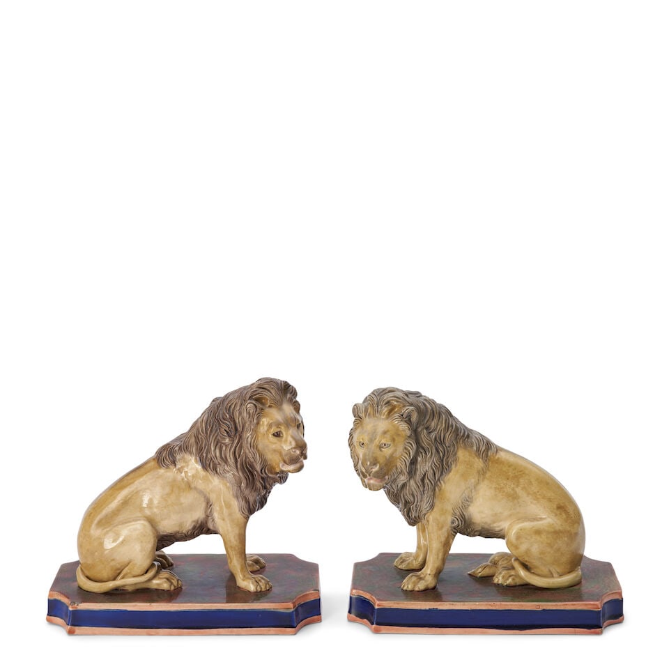 Pair of Copeland Majolica Glazed Earthenware Models of Lions, England, c. 1880,: Pair of Copeland Majolica Glazed Earthenware Models of Lions, England, c. 1880, polychrome enameled and mounted atop cut-corner rectangular bases, impressed mark, ht. 7 1/4 in. For further information