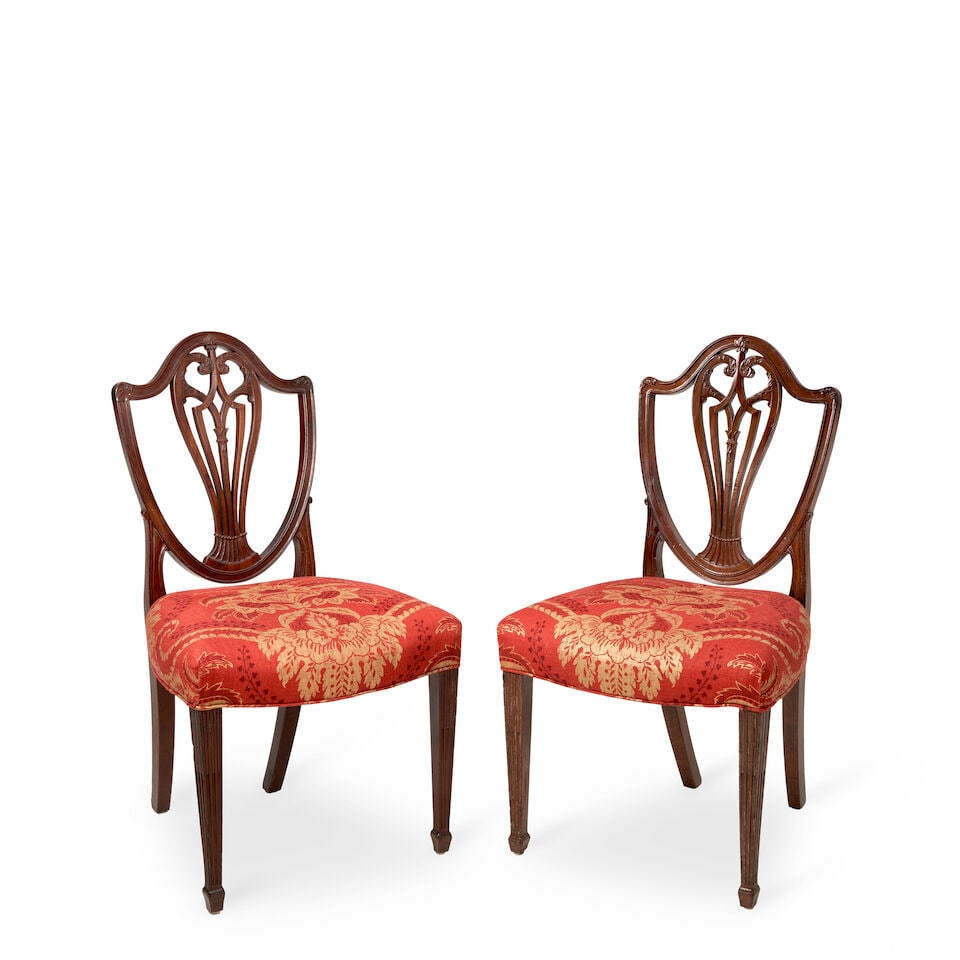 Pair of Hepplewhite Mahogany Side Chairs, America, late 18th century,: Pair of Hepplewhite Mahogany Side Chairs, America, late 18th century, each with a shield-shaped back centered by a pierced splat, over a custom upholstered seat, raised on tapering, reeded legs,ht. 37